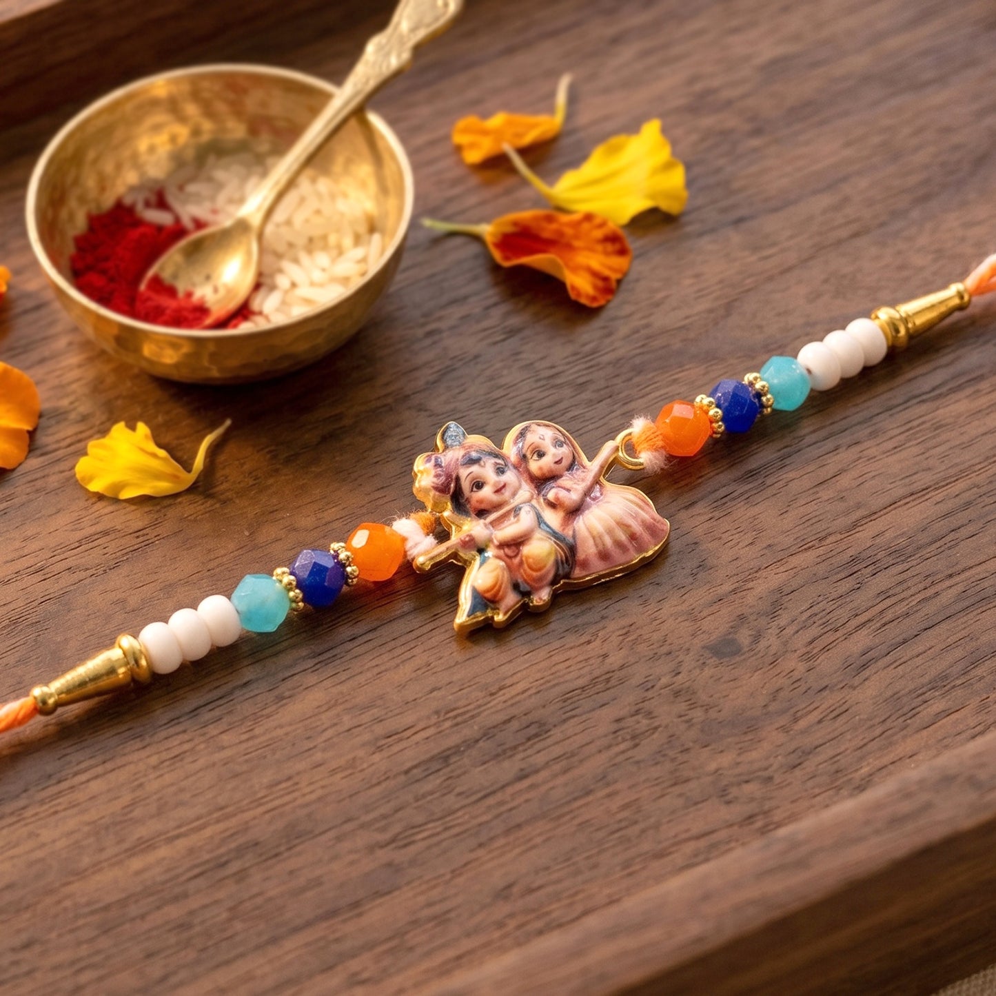 Close-up of Radha Krishna Rakhi showcasing centerpiece and detailing