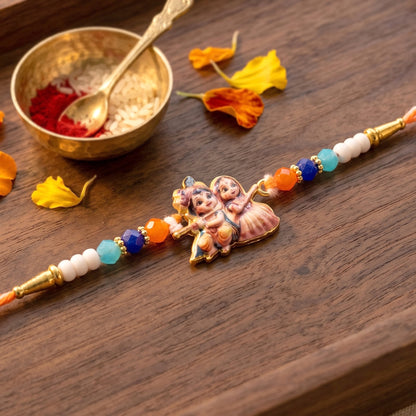 Close-up of Radha Krishna Rakhi showcasing centerpiece and detailing
