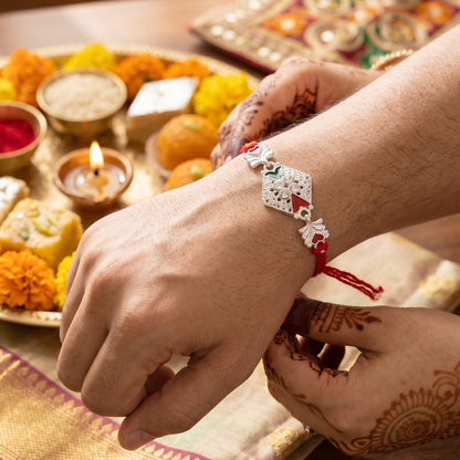 Silver Elephant Charm Rakhi with Red Green Stones and Crystals
