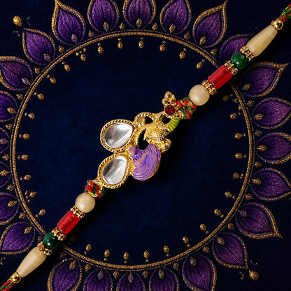 Floral Kundan Pendant Rakhi with Purple Peacock Accent