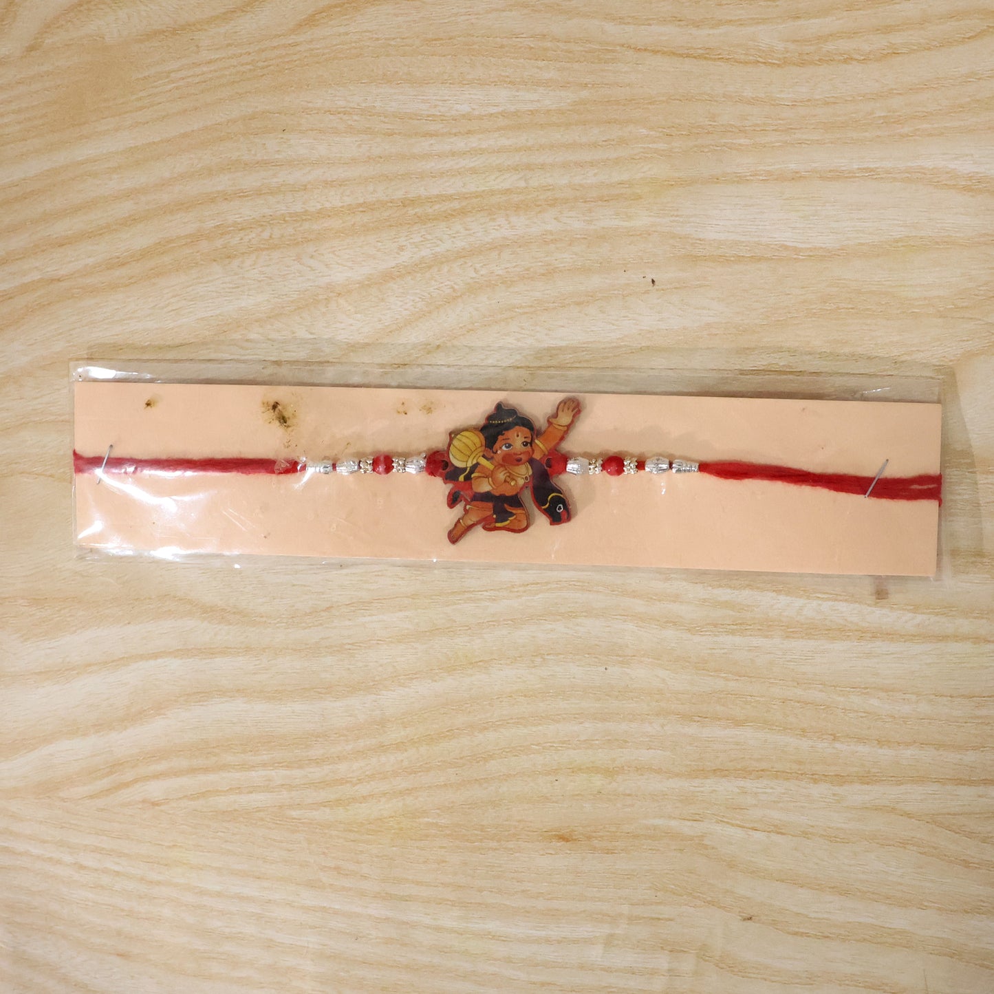 Little Hanuman Rakhi with Red Thread and Silver Bead Chain