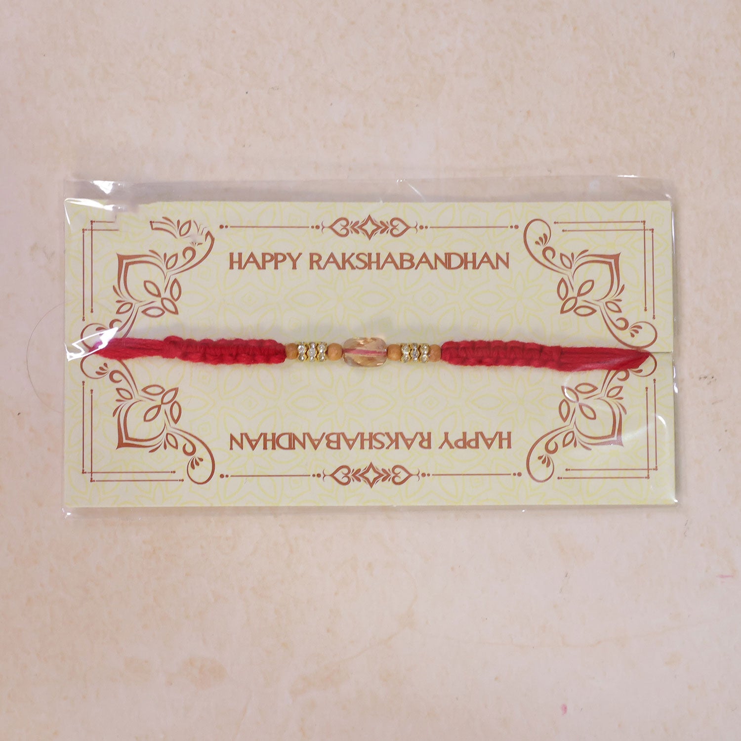 Red Thread Rakhi with Wooden Beads and a Sparkling Crystal Accent