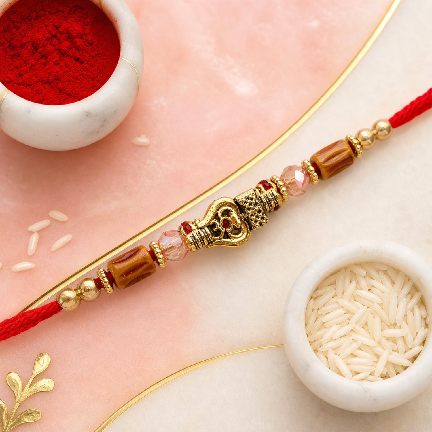 Red Thread Rakhi with Amber Beads and Antique Gold Lantern Charm