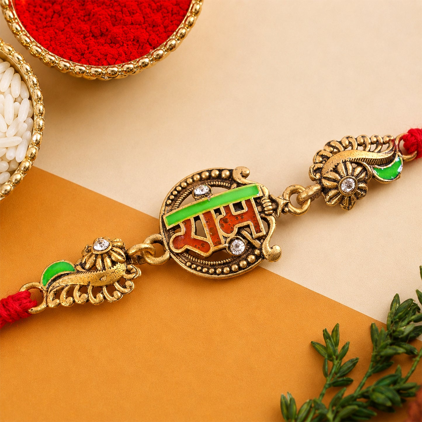 Antique Gold-Toned Ram Rakhi with Crystal Accents, Green Enamel & Designer Red Thread