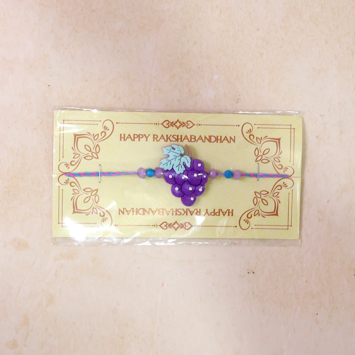 Shop Grape Bunch Charm Kids Beaded Designer Rakhi for Brother (10pcs)