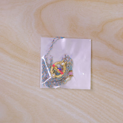 Colorful Circular Charm Rakhi with Pink Blue Beads and Festive Brother Gift Appeal