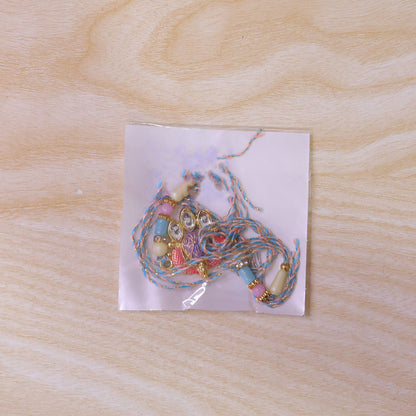 Coral Enamel Medallion Pendant Rakhi with Kundan Teardrop Stones