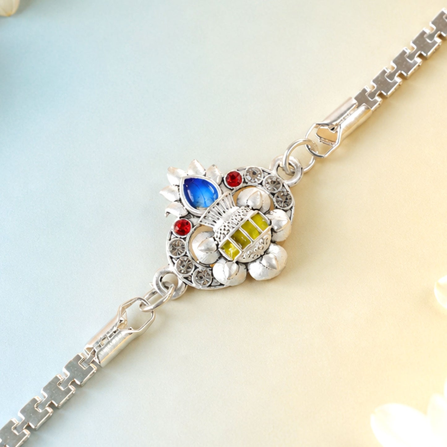 Kalash Lotus Petal Enamel Crystal Studded Silver Chain Designer Rakhi
