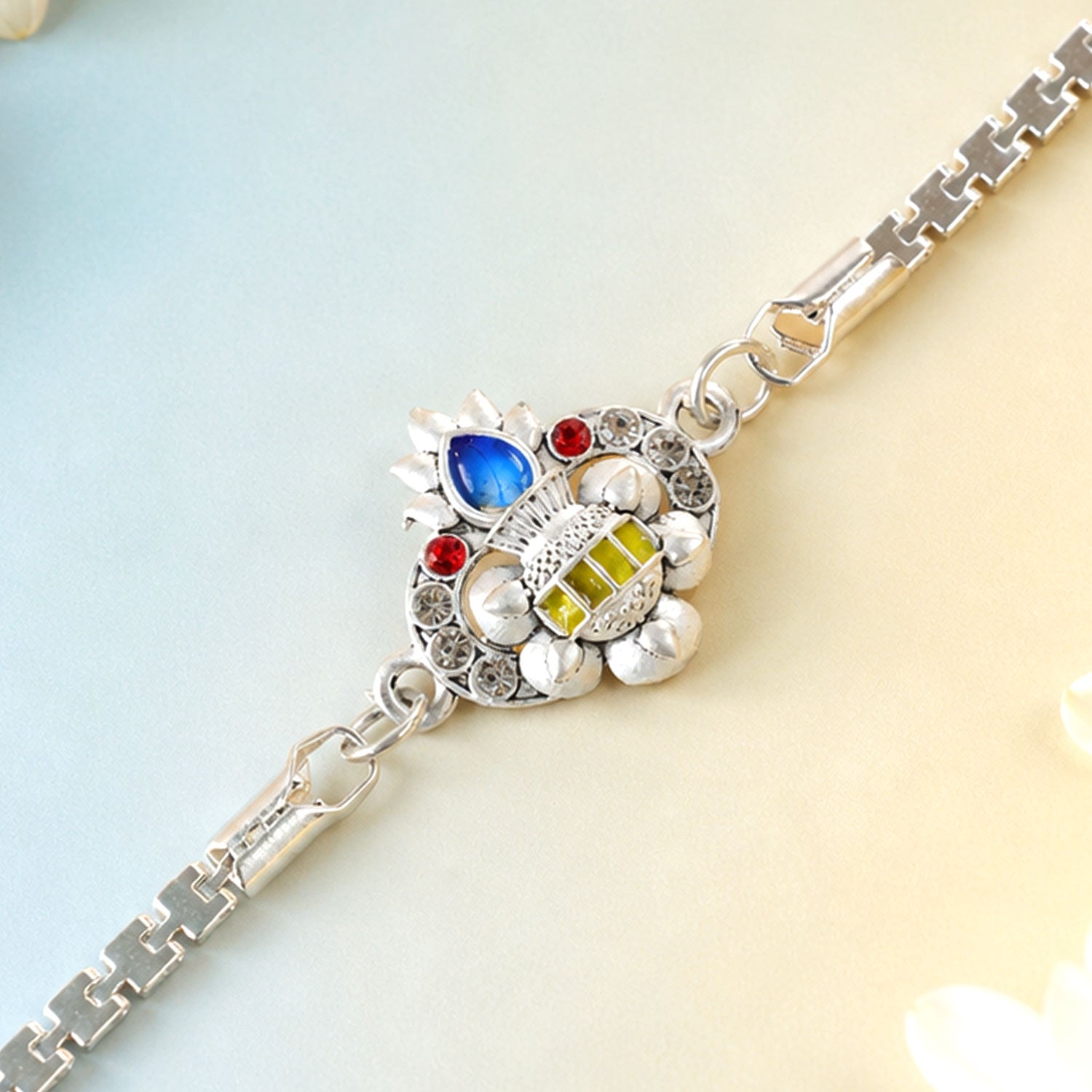 Kalash Lotus Petal Enamel Crystal Studded Silver Chain Designer Rakhi