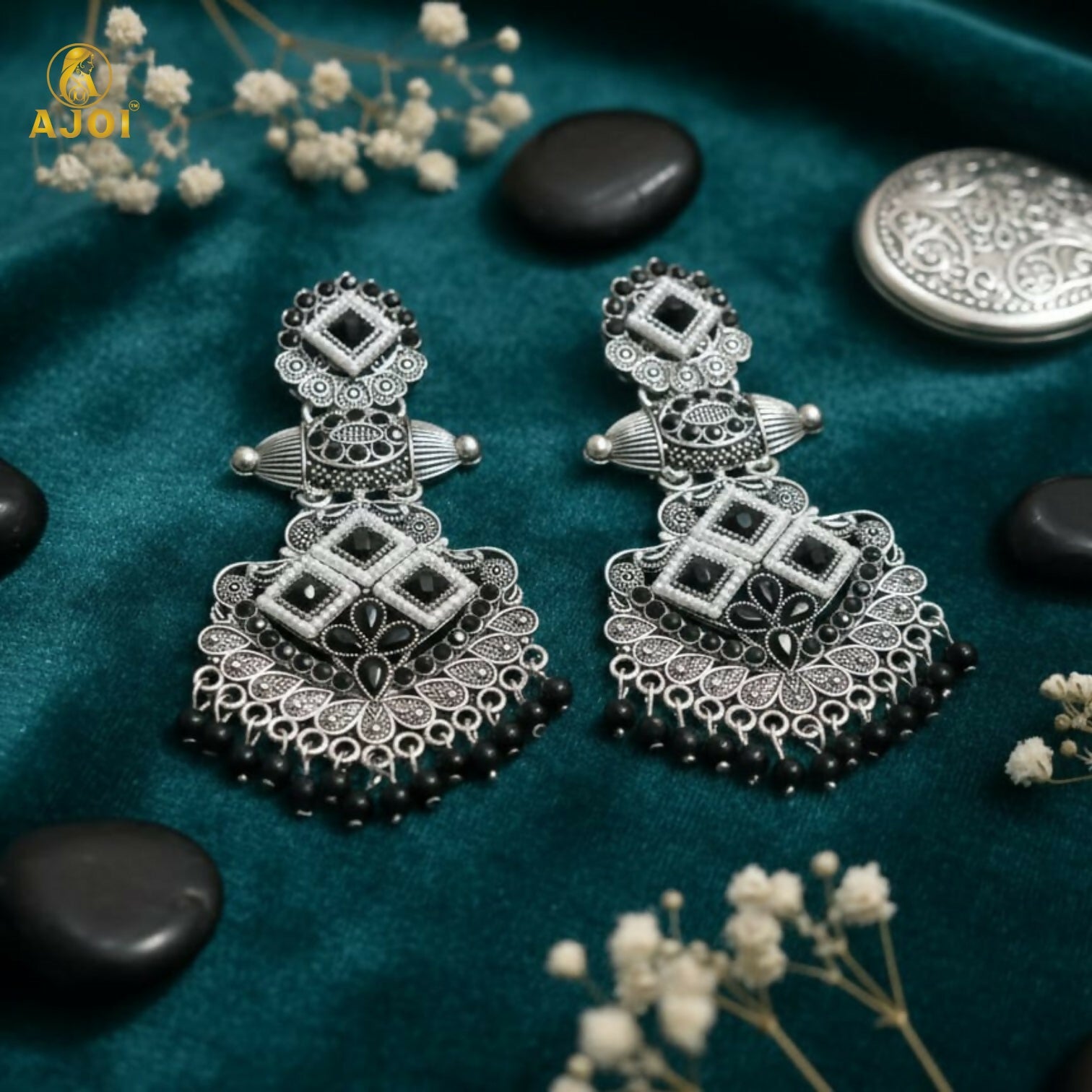 Black bead hangings on traditional chandbali earrings