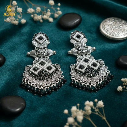 Black bead hangings on traditional chandbali earrings