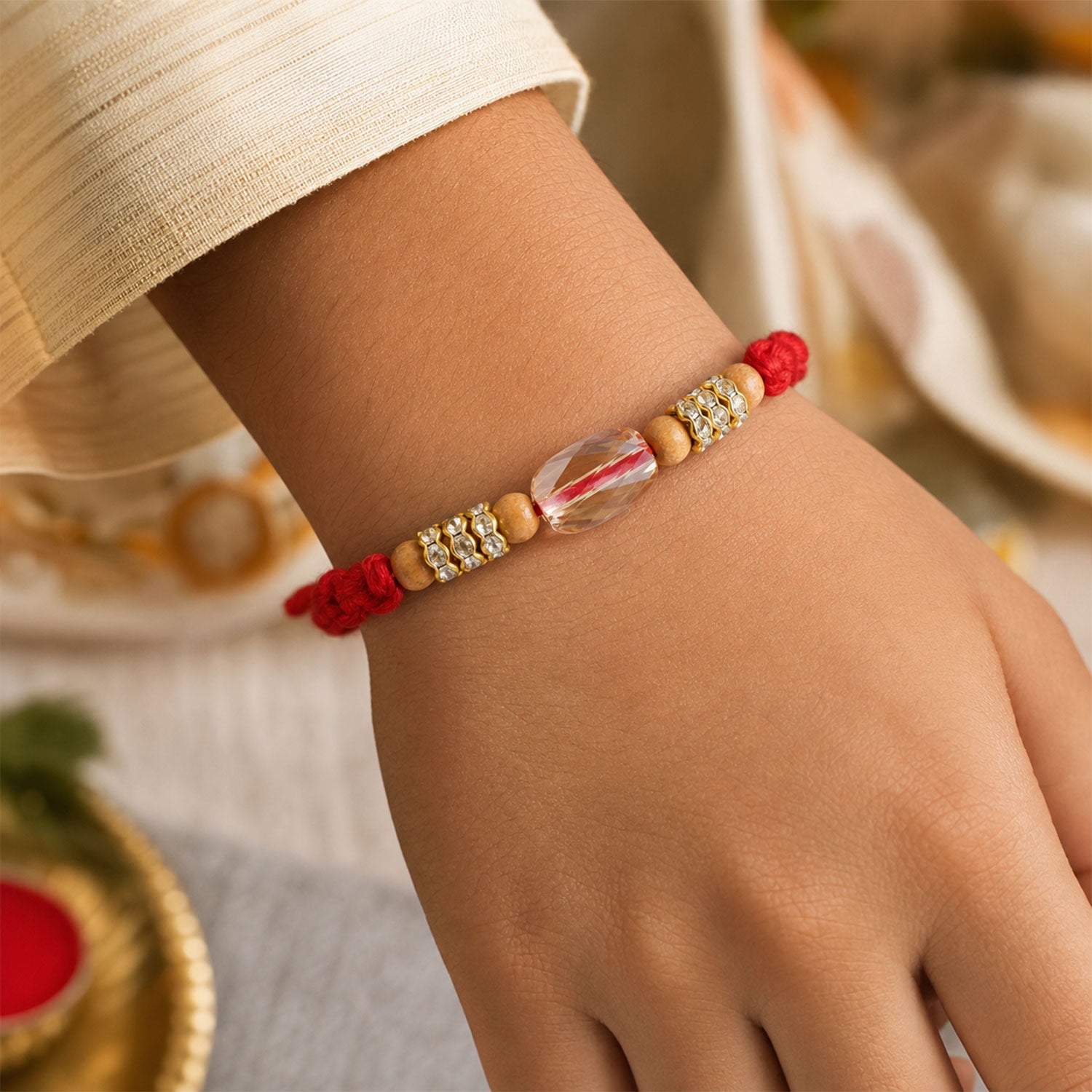 Red Thread Rakhi with Wooden Beads and a Sparkling Crystal Accent