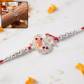 Silver Om Ganesh Rakhi – Traditional with Red Stones & Beads