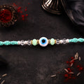 Blue Evil Eye Nazar Charm Rakhi – Turquoise Thread Bracelet