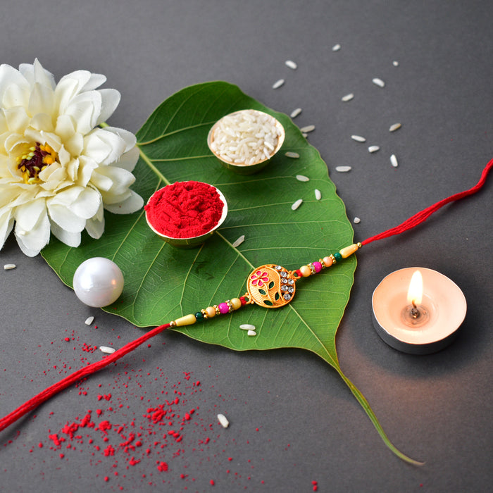 Flower Diamond Rakhi With Red And Green Mina With Square Pooja Thali Set ,Silver Color Pooja Coin, Roli Chawal & Greeting Card