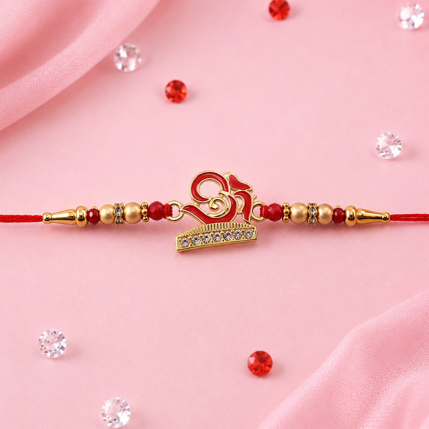 Traditional Rakhi with OM design, beautifully handcrafted for Raksha Bandhan.
