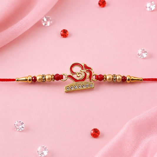Traditional Rakhi with OM design, beautifully handcrafted for Raksha Bandhan.