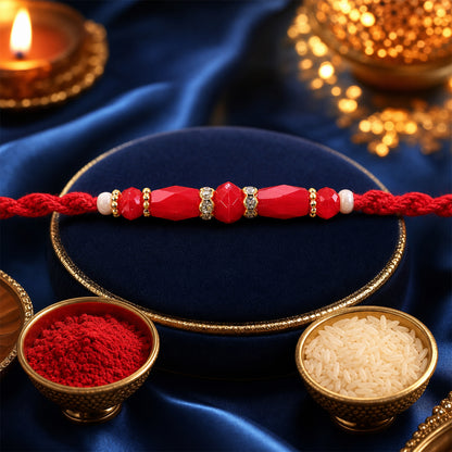White Thread Rakhi with Smooth Red Oval Bead Accents