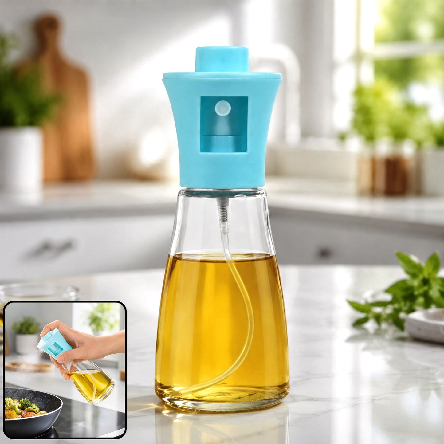 Clear glass oil spray bottle with a light blue top, filled with yellow oil, on a kitchen counter.