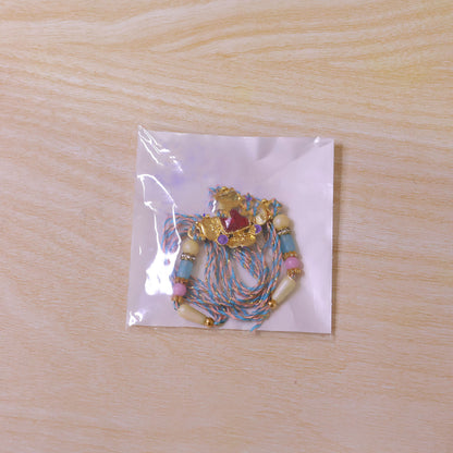 Ornate Rakhi showcasing Square Crystal Charm, gift finish and chain look for Gift Use