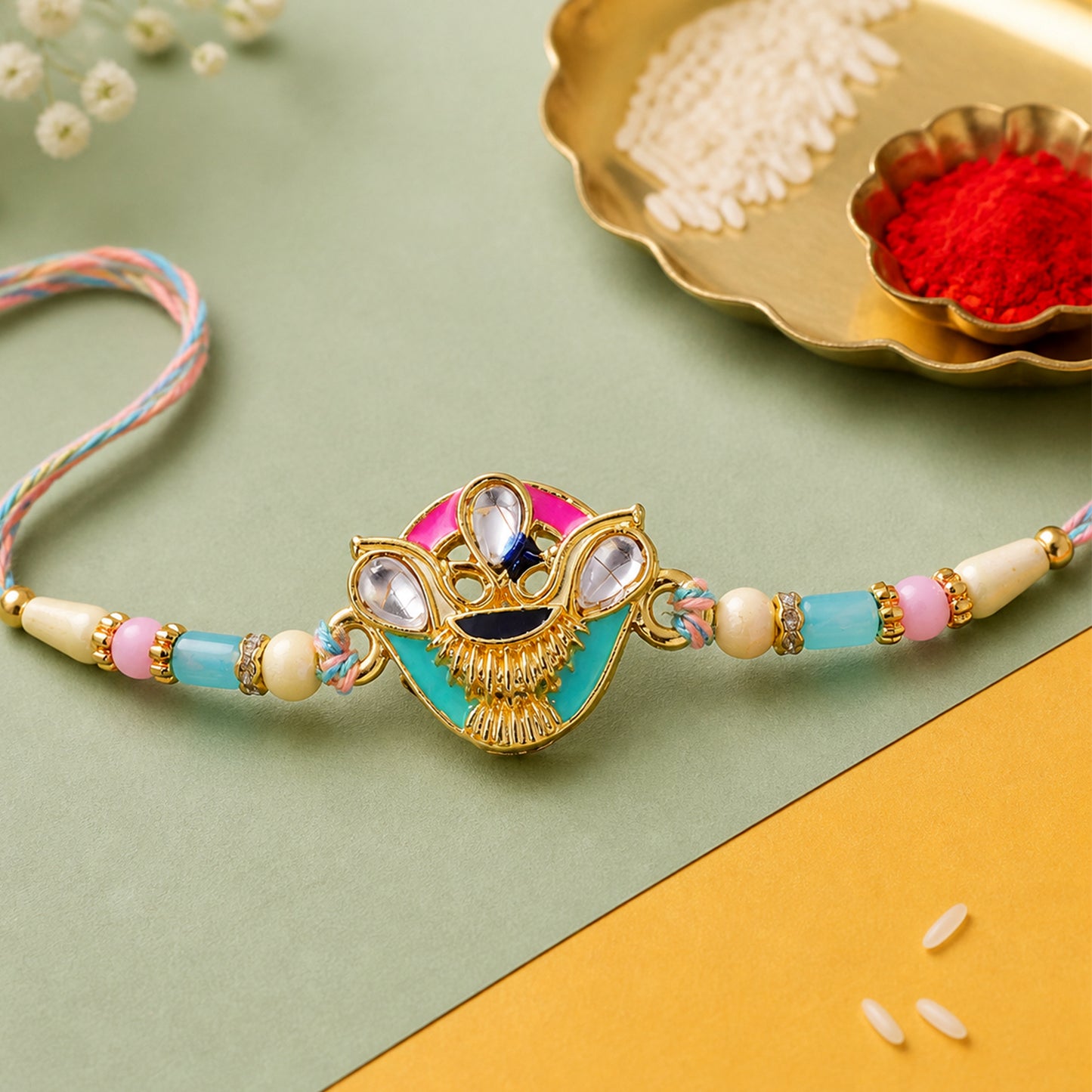 Crown Shaped Kundan Pendant Rakhi with Pink and Teal Enamel