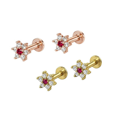 Elegant flower labret studs showing flat back comfort design and ruby-coloured centre