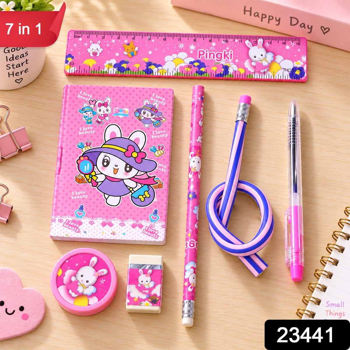 A pink rabbit-themed stationery set on a wooden table, including a ruler, notebook, two pencils, a pen, a – view 2