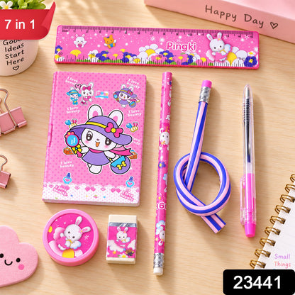 A pink rabbit-themed stationery set on a wooden table, including a ruler, notebook, two pencils, a pen, a – view 2