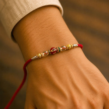 Red Enamel Golden Designer Rakhi with Transparent Beads and Rich Festive Shine