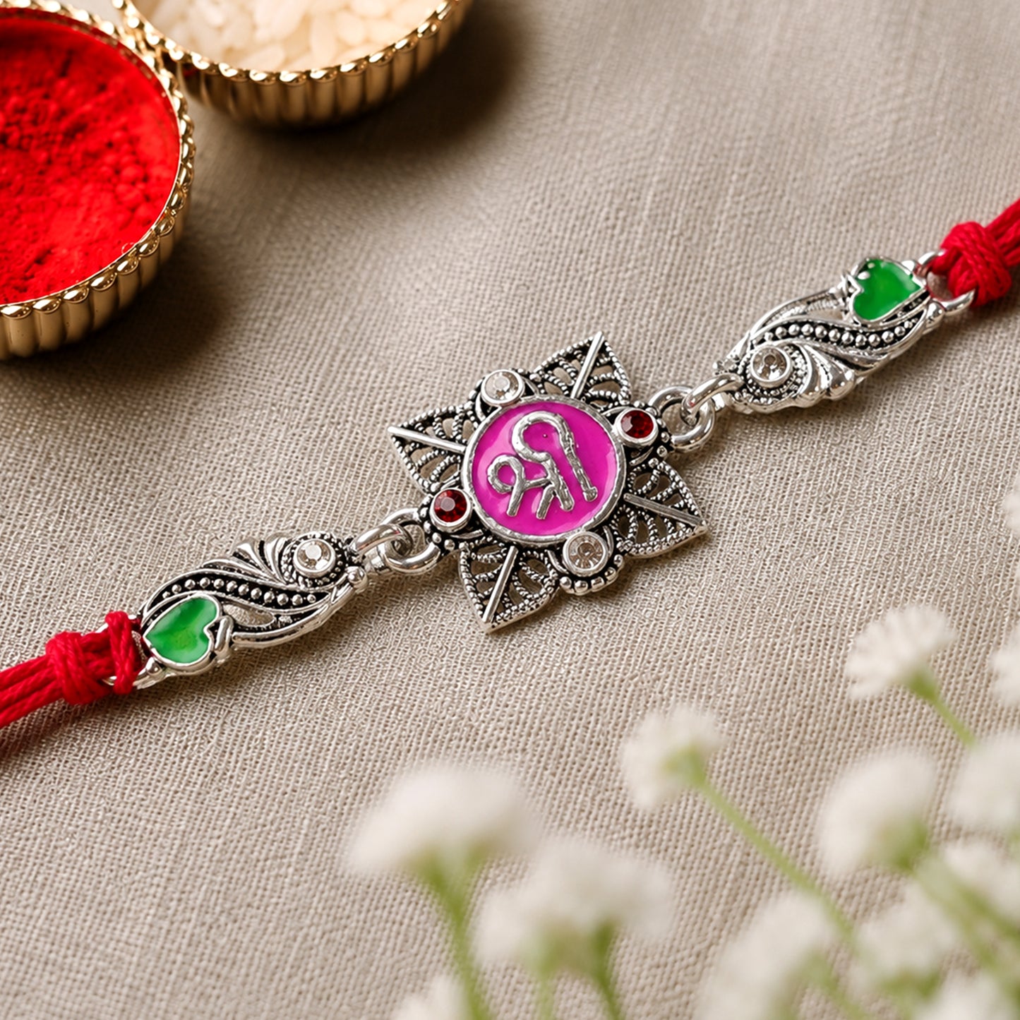 Silver-Toned Shree Rakhi with Pink Enamel, Crystal Accents & Designer Red Thread
