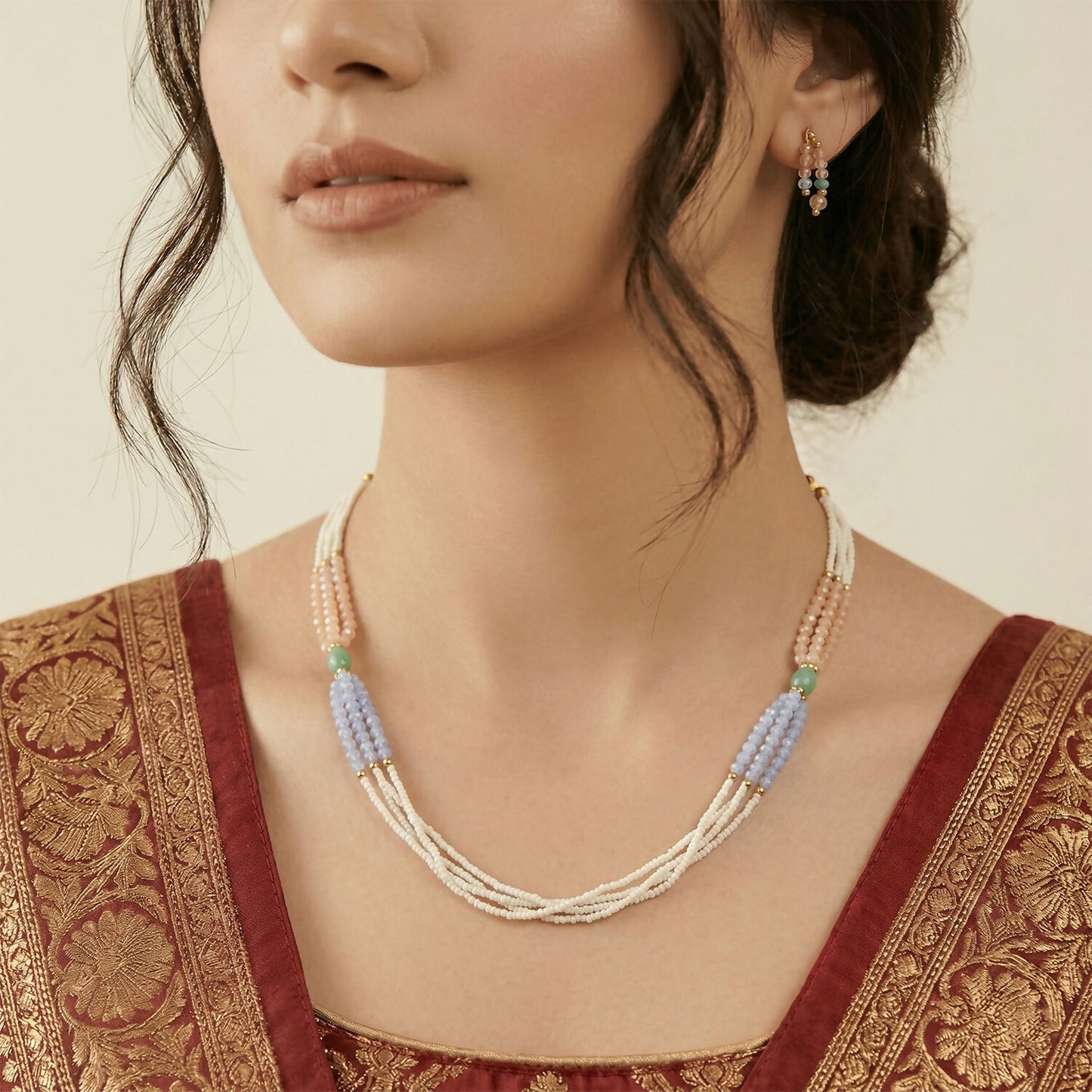 Stylish pastel pearl necklace layered for a graceful look