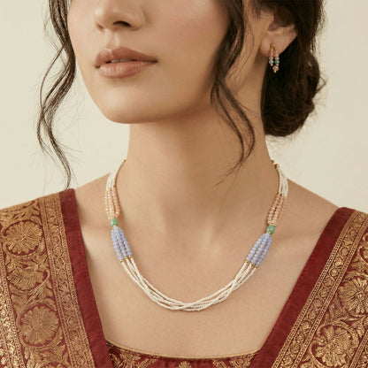 Stylish pastel pearl necklace layered for a graceful look