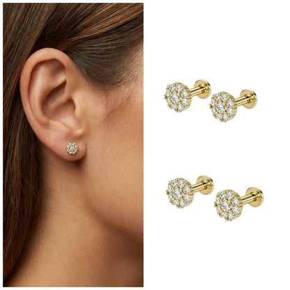 Close-up of cluster stud earrings showcasing gold pleated finish and diamond cluster