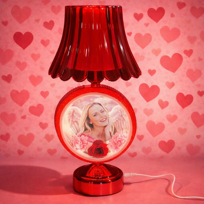 Red decorative shade photo table lamp glowing in bedroom setting