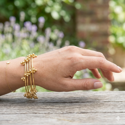 Set of gold-toned Kashmiri bangles with cultural patterns