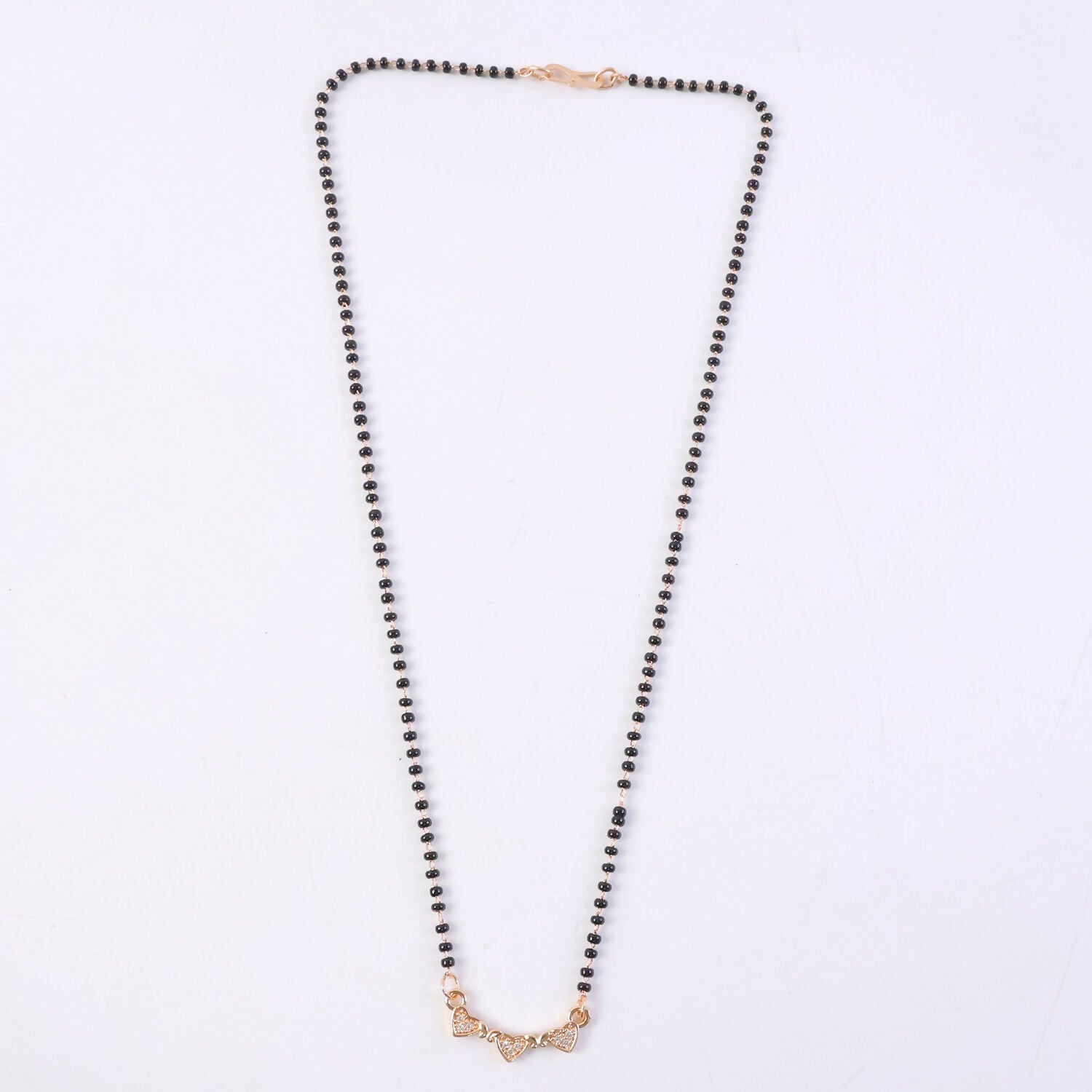 Fashionable mangalsutra necklace with intricate design and crystal accents.