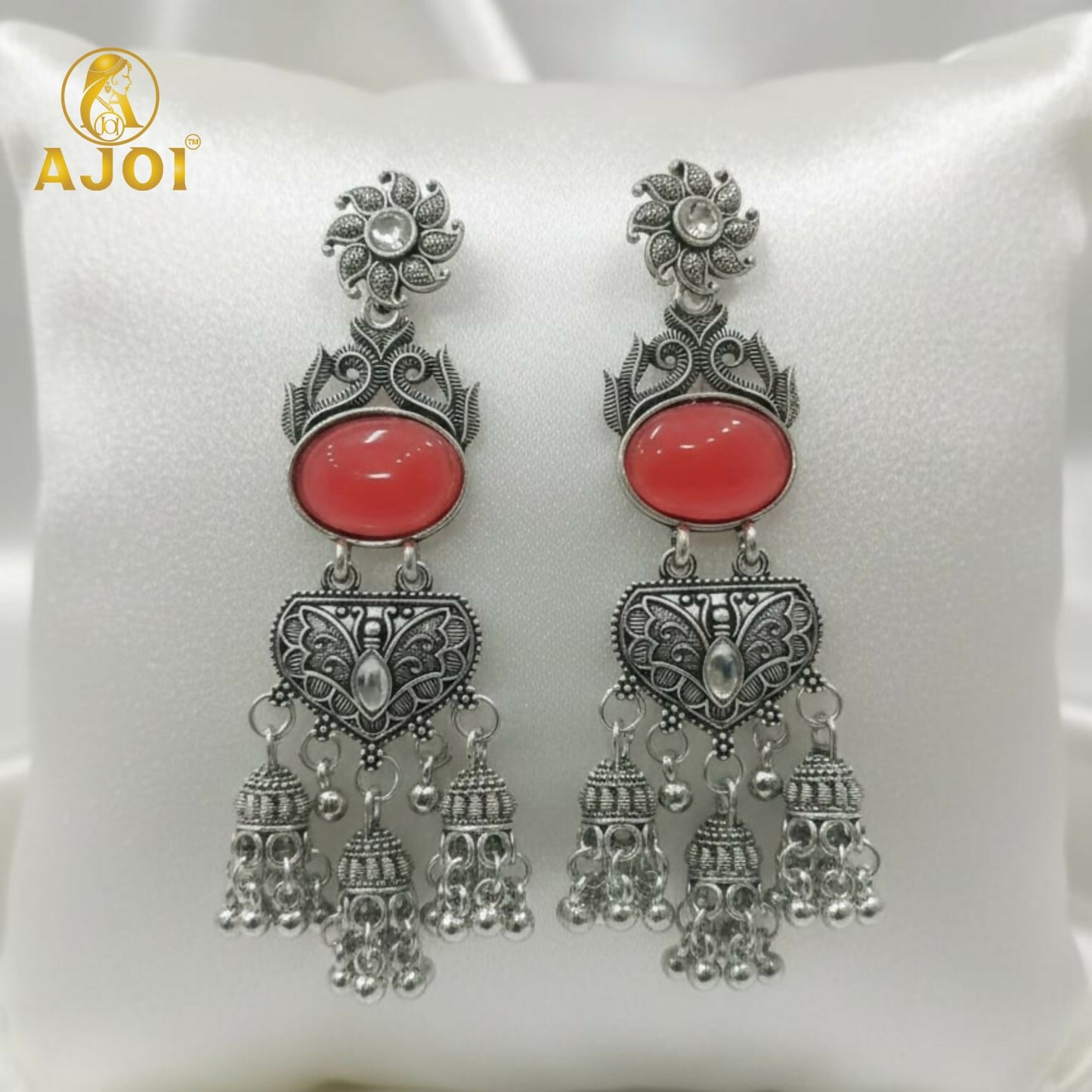Vintage-Inspired Oxidized Silver Red Stone Jhumka Earrings with Ornate Filigree Design and Cascading Bell Danglers