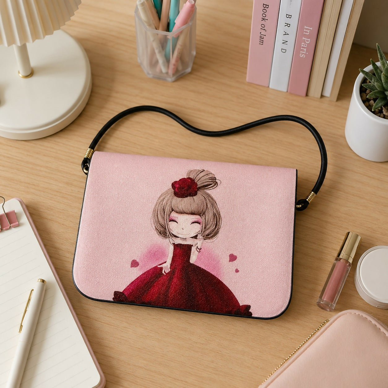 Pink sling bag with cute cartoon girl print front view