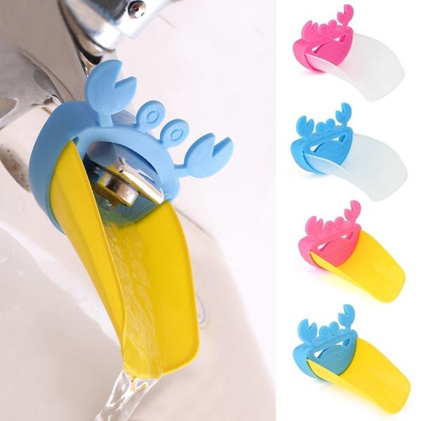 Silicone sink handle extender for children, installed on a faucet for easy access.