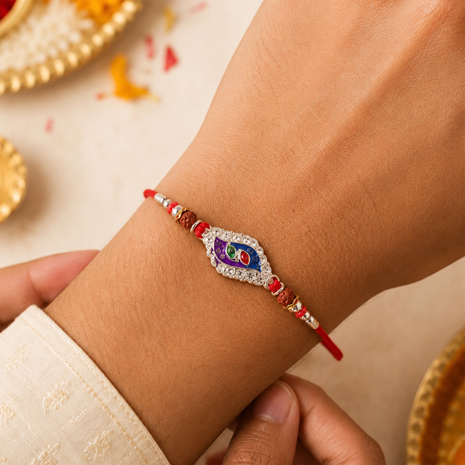Morpich Enamel Rakhi with Silver Beads and Red Thread
