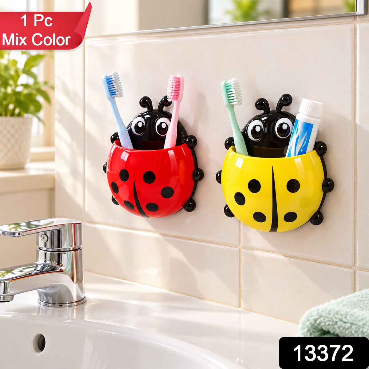 Two ladybug holders, red and yellow, containing toothbrushes and toothpaste, with a sink and mirror.