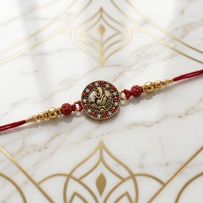 Golden Ganesh Rakhi for Boys with Red Thread and Rudraksha Beads