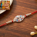 Red Thread Rakhi – Elegant Silver Om Centerpiece for Brothers