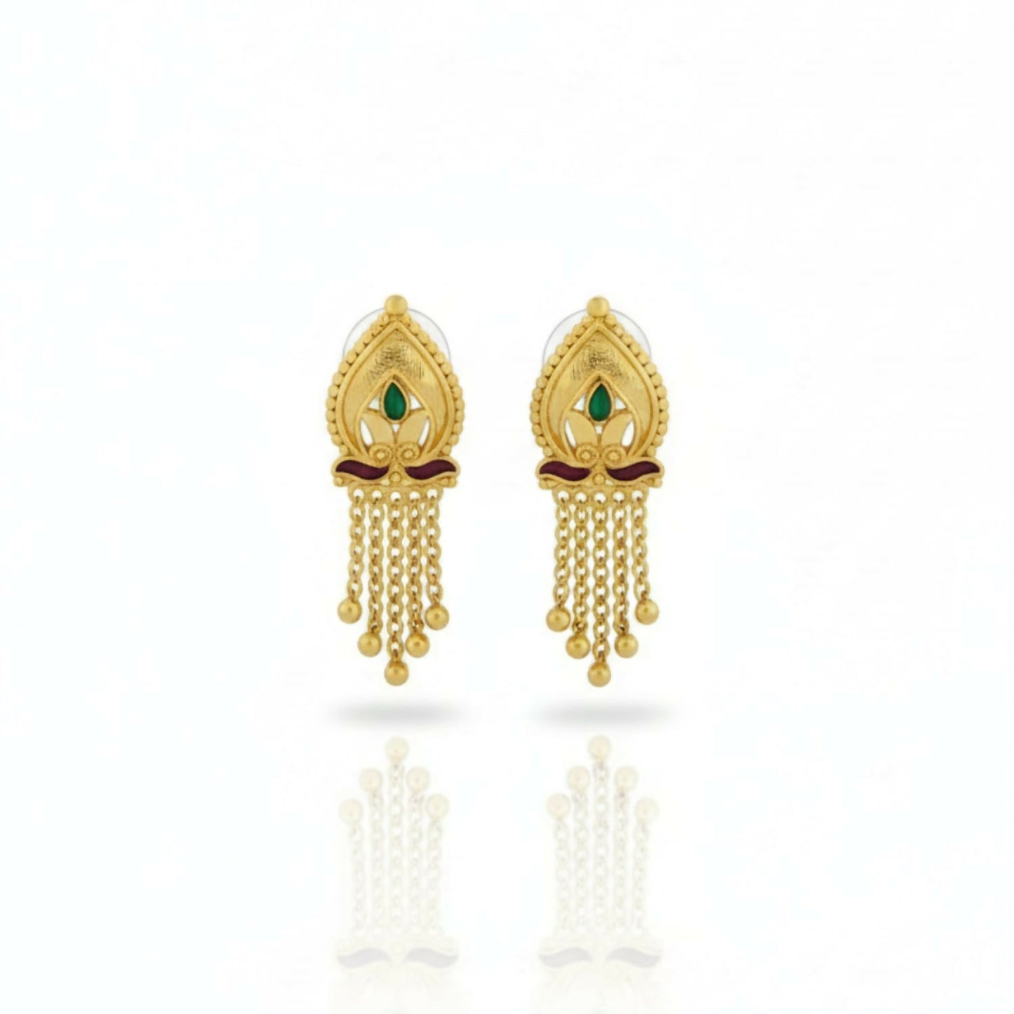 Pair of traditional golden jhumka earrings against a white background highlighting filigree work