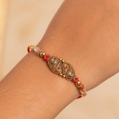 Antique Twin Paisley Kairi Motif Kundan Rakhi with Rudraksha & Crystal Beads