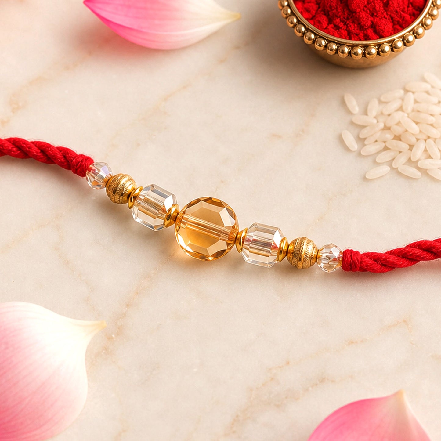 Red Thread Rakhi with Golden and Sparkling Crystal Bead Accents