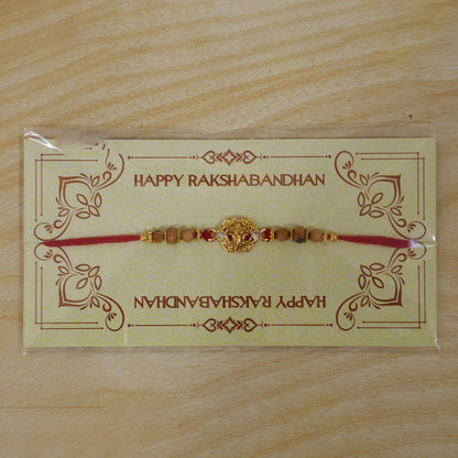 Ganesh Temple Devotional Rakhi with Golden Centre, Wooden Beads and Red Thread