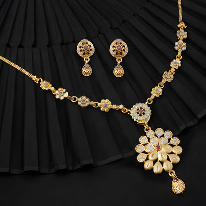 Close-up of designer chain detailing on gold-tone floral necklace set