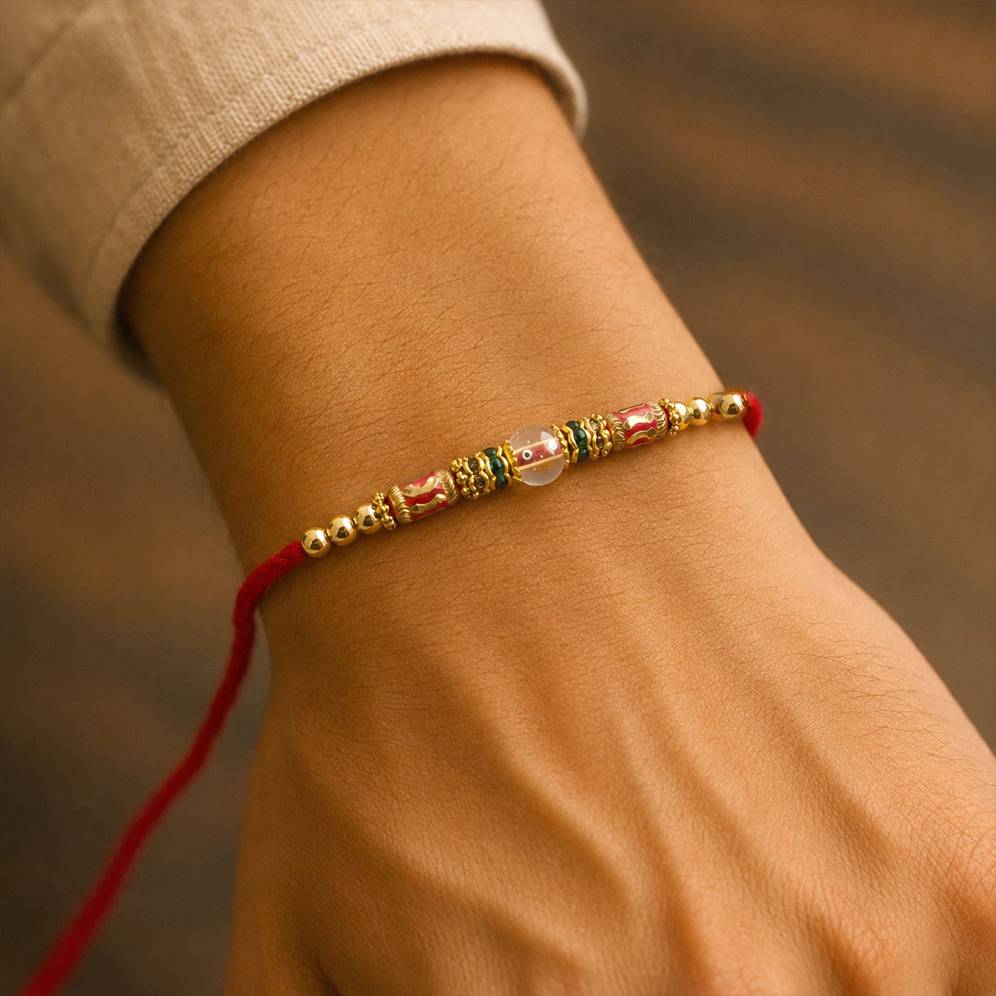 Red Green Stone Golden Designer Rakhi with Traditional Beads and Festive Thread