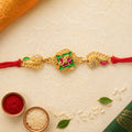 Premium Rakhi showcasing Floral Medallion, crystal accents and chain look for Gift